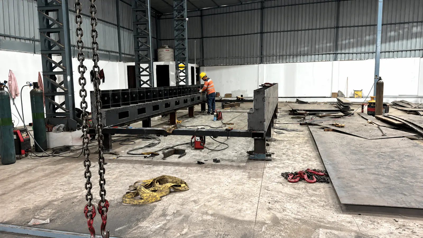 Structural fabrication fit-up work inside the Naxos facility