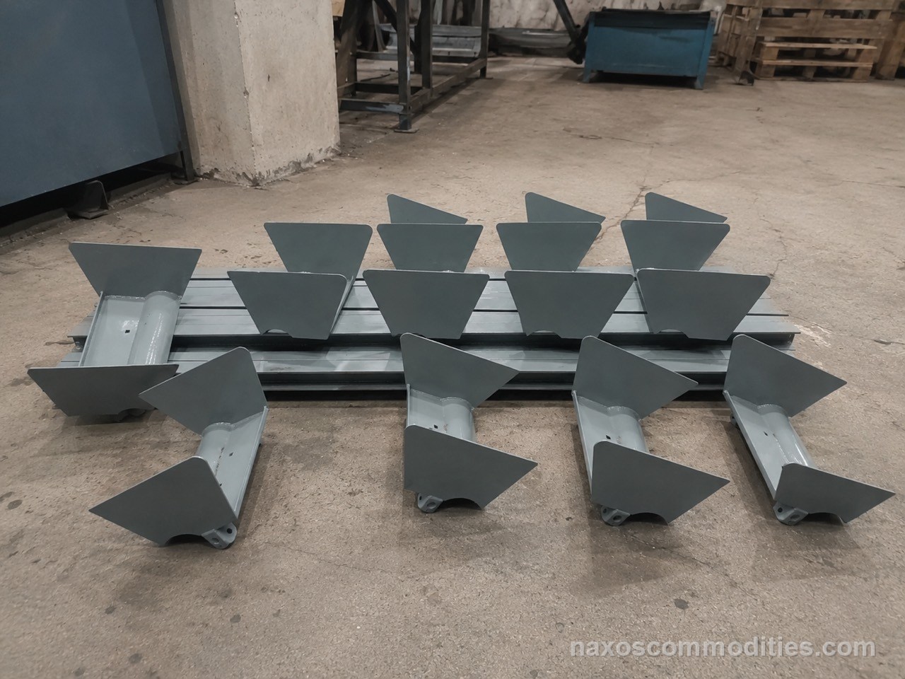 Chain deep pan and conveyor bucket fabrication parts arranged on shop floor