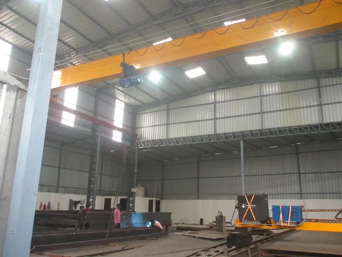 Overhead crane handling inside the Naxos fabrication shop floor